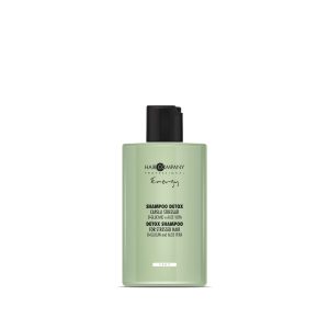 Hair Company UK The product number 0105, a green bottle of Hair Company Professional Energy Detox Shampoo designed for stressed hair, is prominently displayed against a white backdrop. The label emphasizes ginkgo biloba and aloe vera as key ingredients.