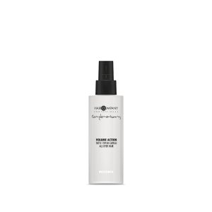 Hair Company UK A white bottle of Hair Company's Volume Action spray, labeled "0111," stands against a plain background. It features a black spray nozzle and text detailing the product's name and usage.