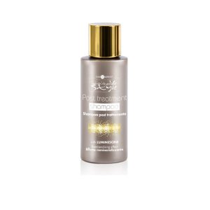 Hair Company UK A 50ml bottle of Post Treatment Shampoo by Hair Company's "10" comes in a metallic gray container with a gold cap, featuring text that highlights "with Luminescine" and "Effetto remineralizzante." It pairs perfectly with the Post Treatment Mask for an enhanced haircare and skincare routine.