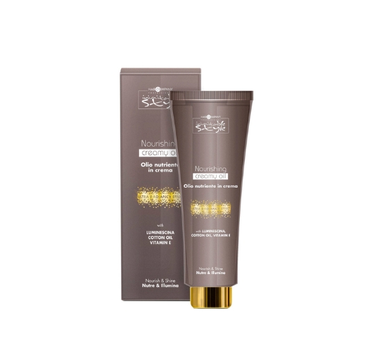 Hair Company UK A tube of NOURISHING CREAMY OIL, presented in its matching box, showcases brown packaging with elegant gold embellishments and text in English and Italian. The formula includes luminisens, cotton oil, and vitamin E.