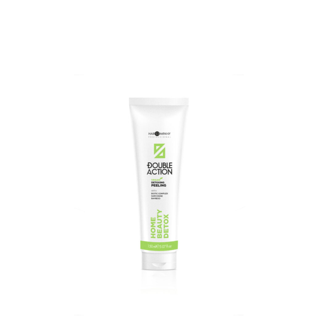 Hair Company UK A white tube of "Detoxing Peeling" by Hair Company Professional stands upright, showcasing its detoxing and peeling features with green and black text against a plain white background. The 150 ml packaging promises a refreshing beauty regimen.