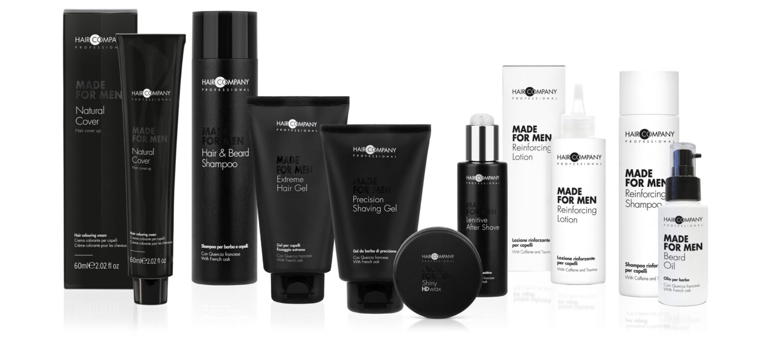 A lineup of Hair Company's "Made for Men" grooming products, including shampoos, shaving gels, beard care, and lotions in black and white packaging that perfectly complements men's style. The branding and product names are prominently displayed on the front of each item.