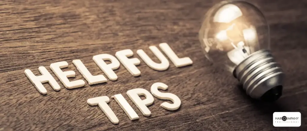 wooden letters spelling "helpful tips" are arranged on a wooden surface beside a lit light bulb, representing ideas or advice—perfect for highlighting hair company uk distributor (4).opti solutions. hair company uk